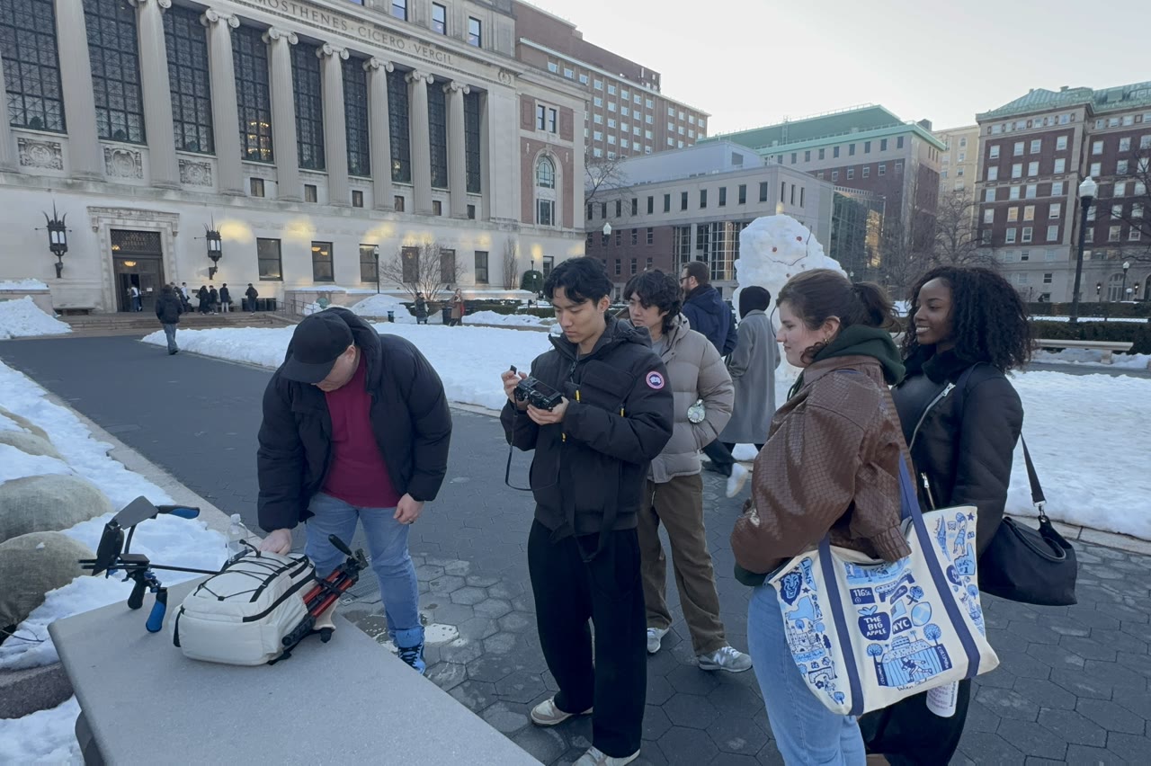 CLiP members outside with camera gear in the snow during Winter Break Blitz.